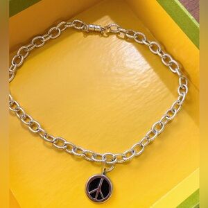 Peace sign pendant on heavy silver chain link necklace